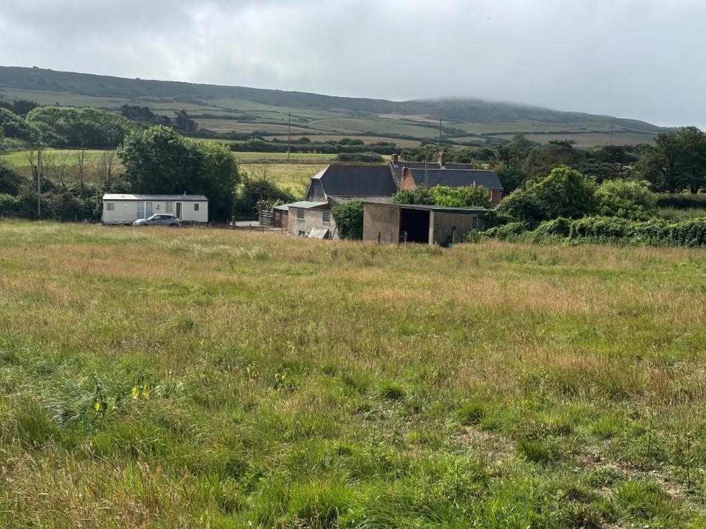 Lot: 53 - TRADITIONAL FARMHOUSE FOR IMPROVEMENT WITH BARNS AND OUTBUILDINGS ON A 2.5 ACRE PLOT - A View Back at the Farmhouse from the Top Paddock